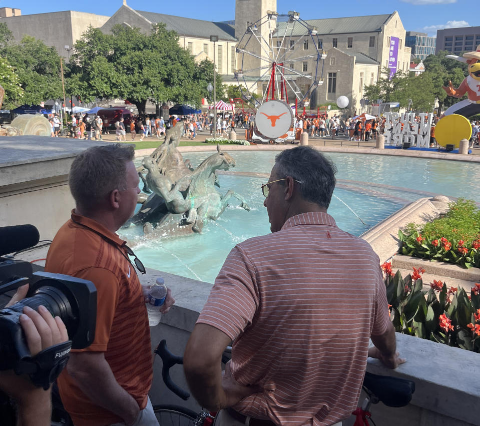 Texas baseball coach Jim Schlossnagle and athletic director Chris Del Conte talk during a party on campus in Austin on Sunday. (Yahoo Sports)