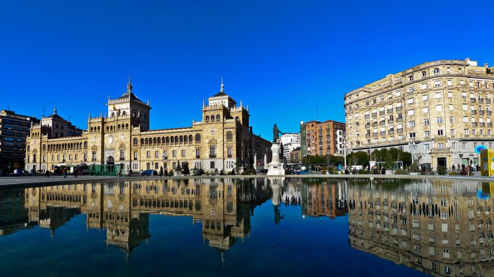 Reflections of buildings in the water below in the city of Valladolid