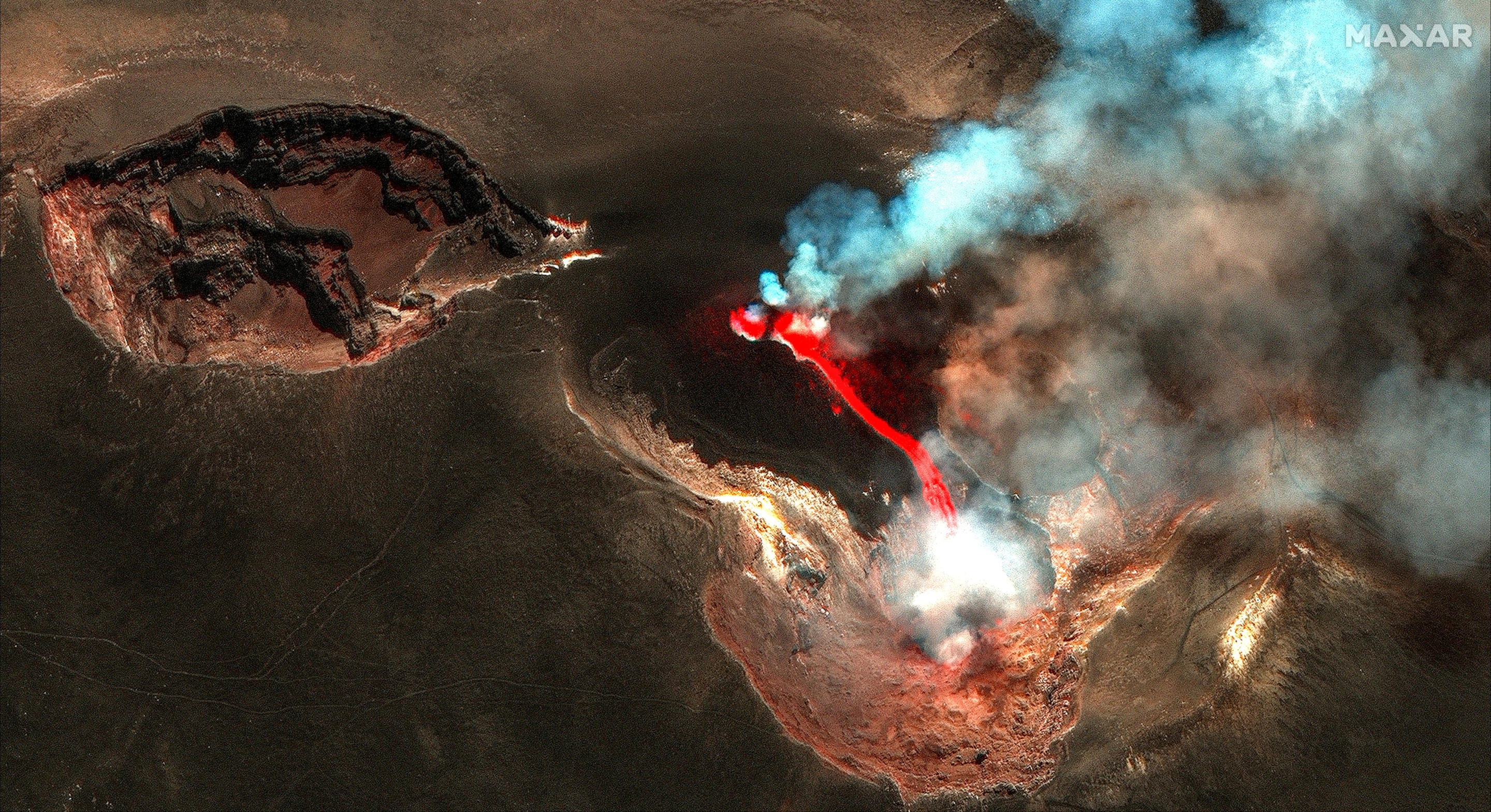 A satellite image shows lava flowing from a crater of Mount Etna, in Sicily, Italy July 4, 2024. (Maxar Technologies/Handout via Reuters)    