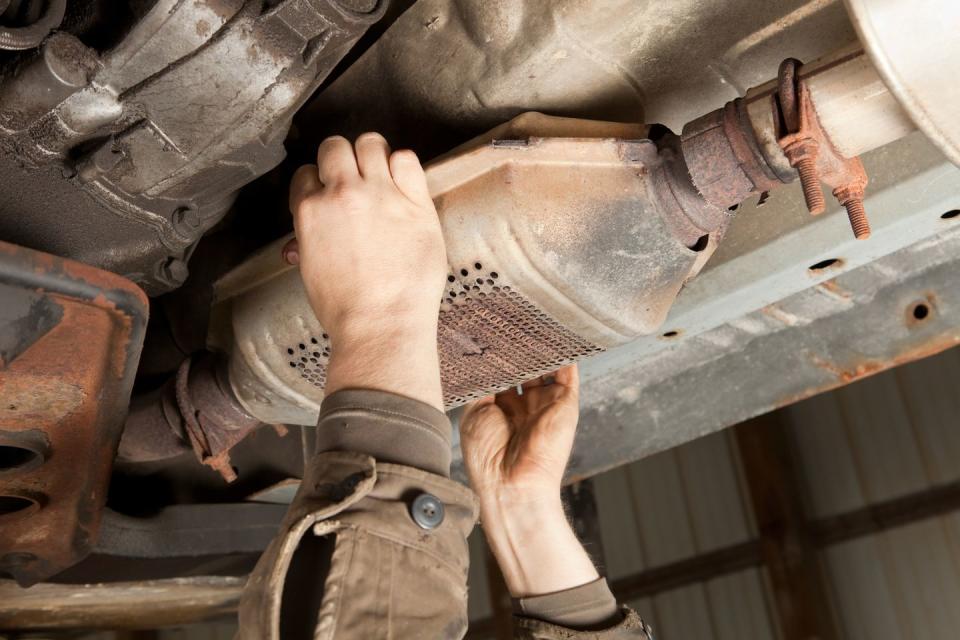 catalytic converter removal at a salvage yard