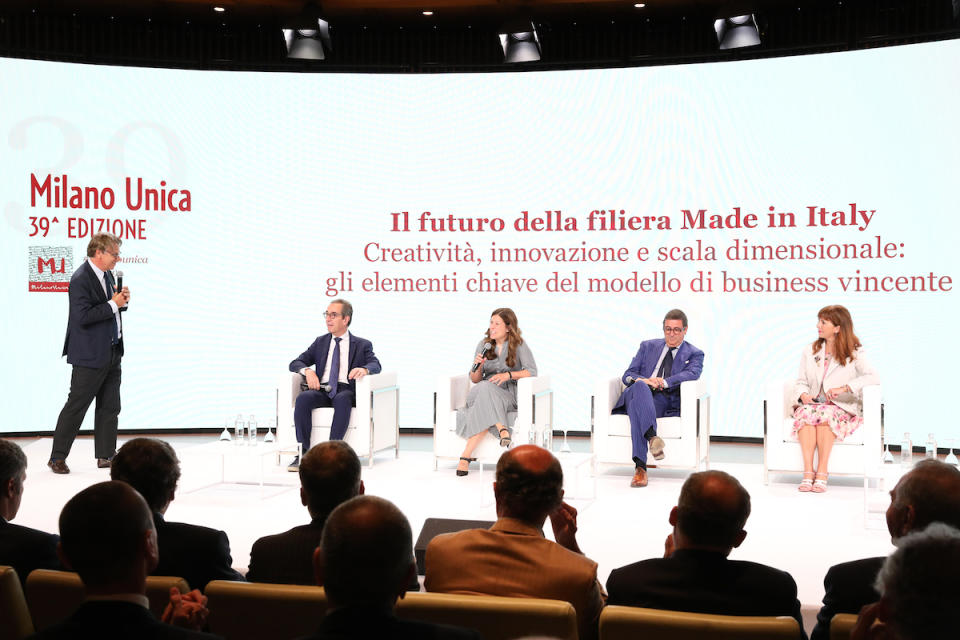 Panelists discussing the future of the made-in-Italy value chain during the opening ceremony.