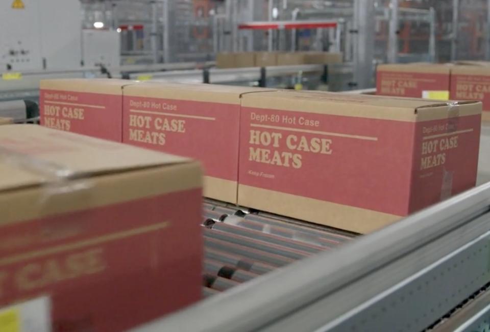 Boxes on rollers at a Walmart automated distribution center