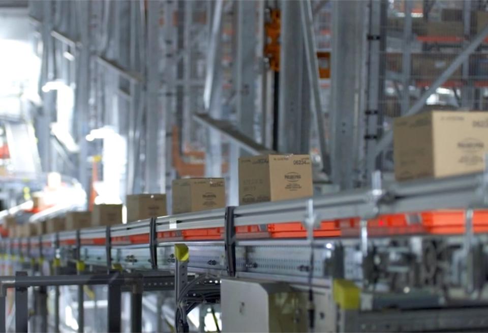 Boxes on a conveyer belt at a Walmart automated distribution center