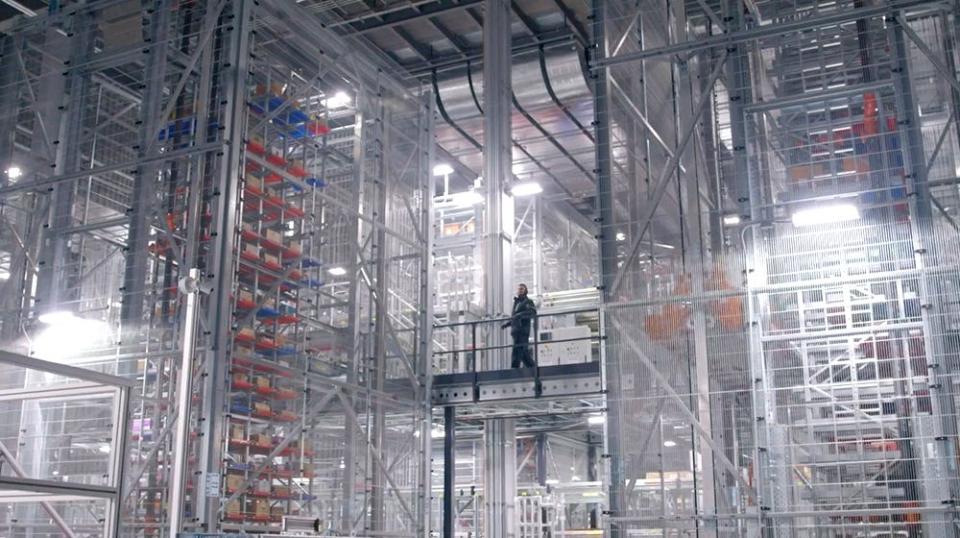 A worker at a Walmart automated distribution center