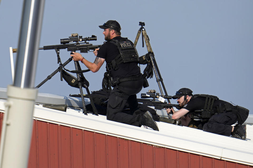 Police snipers returned fire after shots were fired while Donald Trump was speaking at the rally. (Gene J. Puskar / AP)