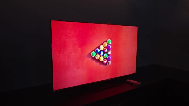 A bird's eye view of a red-felted billiard table with balls racked in the center shown on a HIsense U7N.