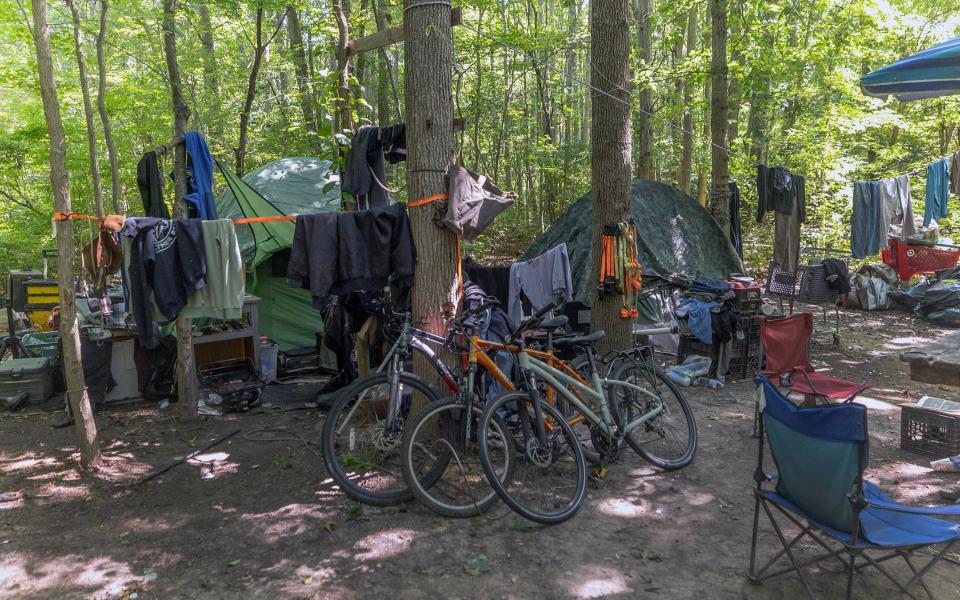 The homeless encampment behind the Neptune ShopRite and Zenleaf off Route 66 has existed for more than a decade, but could come to an end this summer. With 2,000 trash bags piled up, the property owner and township are working to find permanent housing for those who still call the camp home.