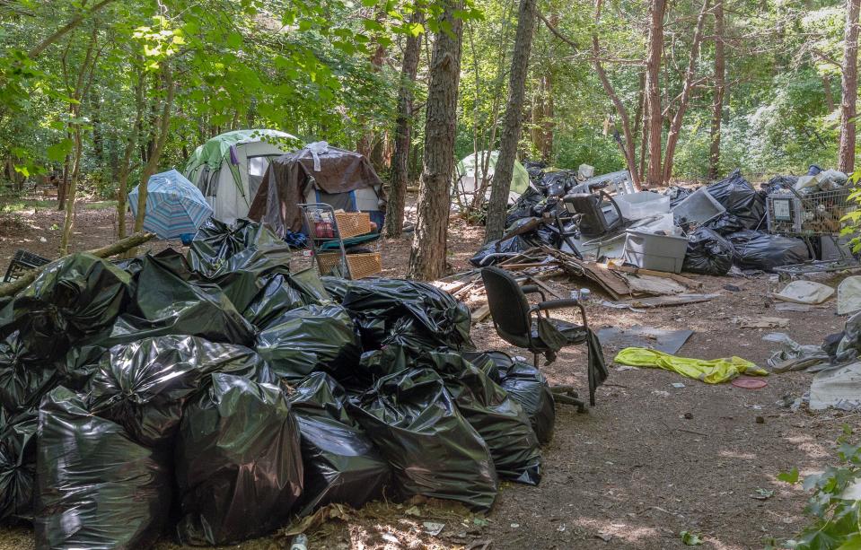 The homeless encampment behind the Neptune ShopRite and Zenleaf off Route 66 has existed for more than a decade, but could come to an end this summer. With 2,000 trash bags piled up, the property owner and township are working to find permanent housing for those who still call the camp home.