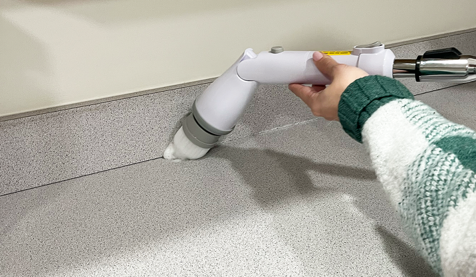 Cleaning a kitchen counter with the kHelfer Electric Spin Scrubber.