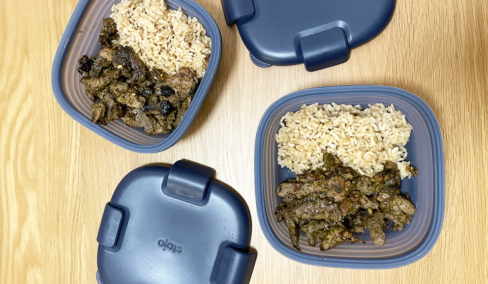 Stojo's collapsible food storage containers shown expanded and filled with rice and beef.