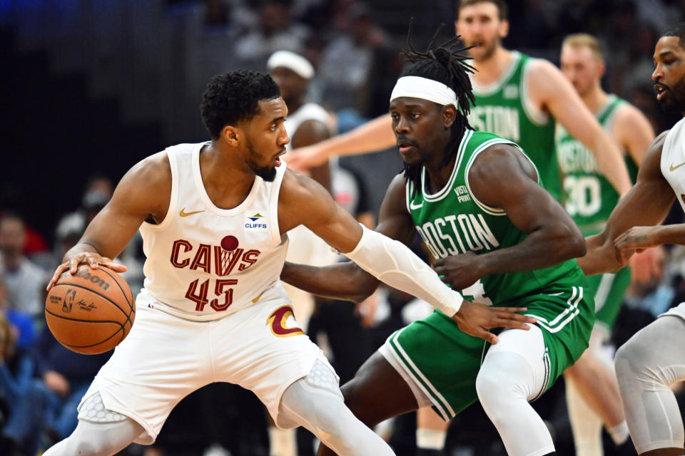 CLEVELAND, OHIO - MAY 11: Donovan Mitchell #45 of the Cleveland Cavaliers drives to the basket around Jrue Holiday #4 of the Boston Celtics during the second quarter of game three of the Eastern Conference Second Round Playoffs at Rocket Mortgage Fieldhouse on May 11, 2024 in Cleveland, Ohio. The Celtics defeated the Cavaliers 106-93. NOTE TO USER: User expressly acknowledges and agrees that, by downloading and or using this photograph, User is consenting to the terms and conditions of the Getty Images License Agreement. (Photo by Jason Miller/Getty Images)