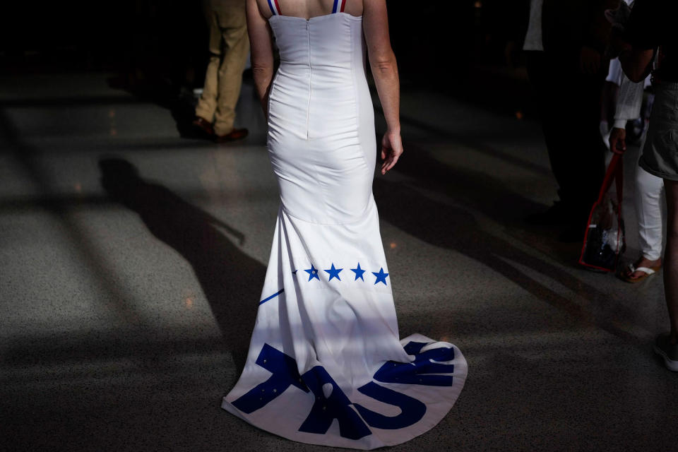 A delegate wears a gown that says Trump  (Jae C. Hong / AP)