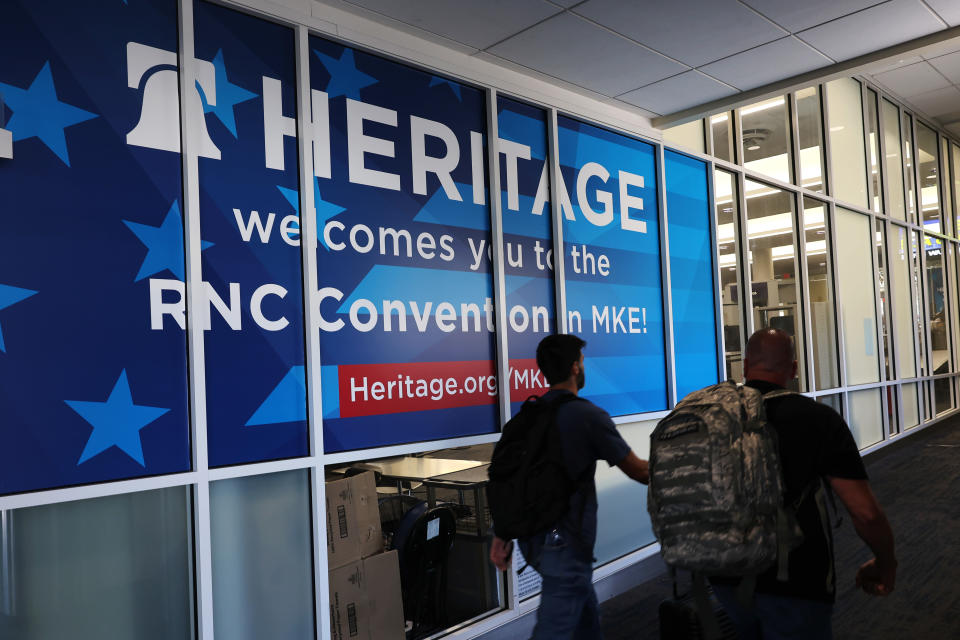 MILWAUKEE, WISCONSIN - JULY 12: People walk past a Heritage Foundation welcome sign for the Republican National Convention (RNC) at the Milwaukee Mitchell International Airport on July 12, 2024 in Milwaukee, Wisconsin. Republican presidential candidate, former U.S. President Donald Trump is expected to formally accept the GOP nomination for the 2024 U.S. presidential election during the convention.  (Photo by Michael M. Santiago/Getty Images)