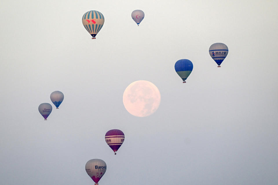 Hot air balloons in Capaddocia during a night of full moon