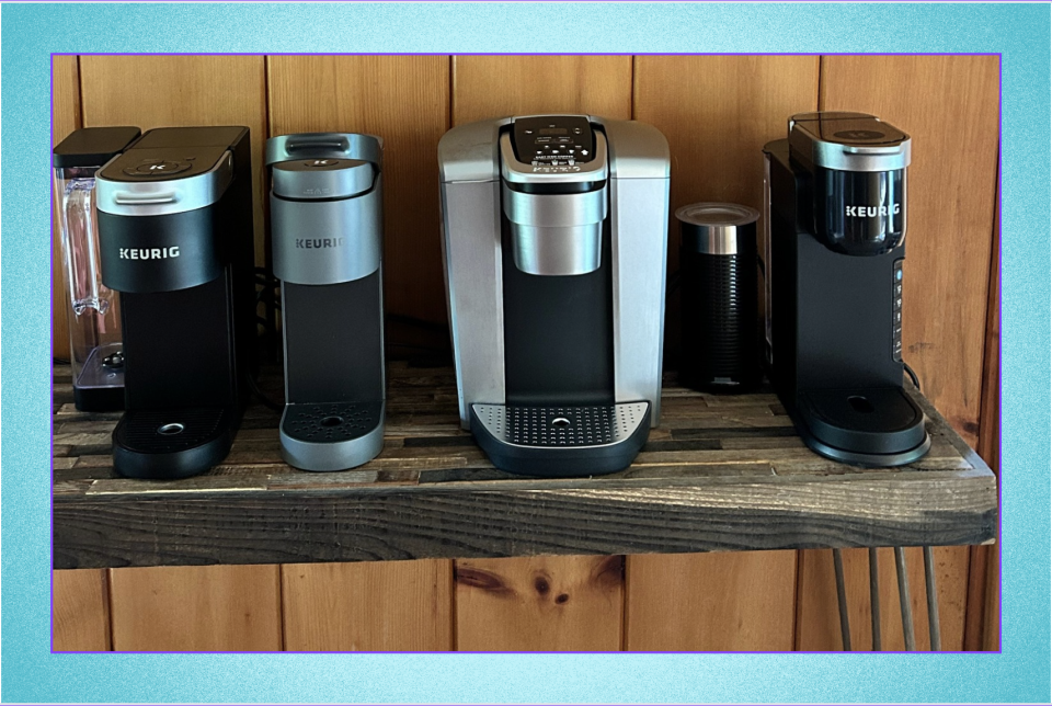 Four Keurig coffee makers on a table