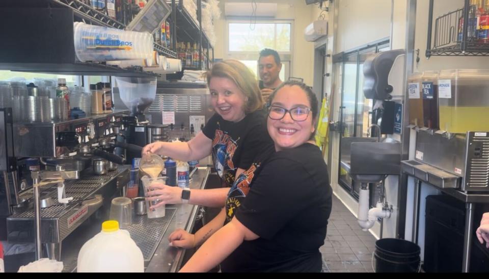 Dutch Bros CEO Christine Barone with broista Valerie “Val” Rodriguez inside a Dutch Bros shop in Phoenix, Arizona. (Taken by Yahoo Finance)