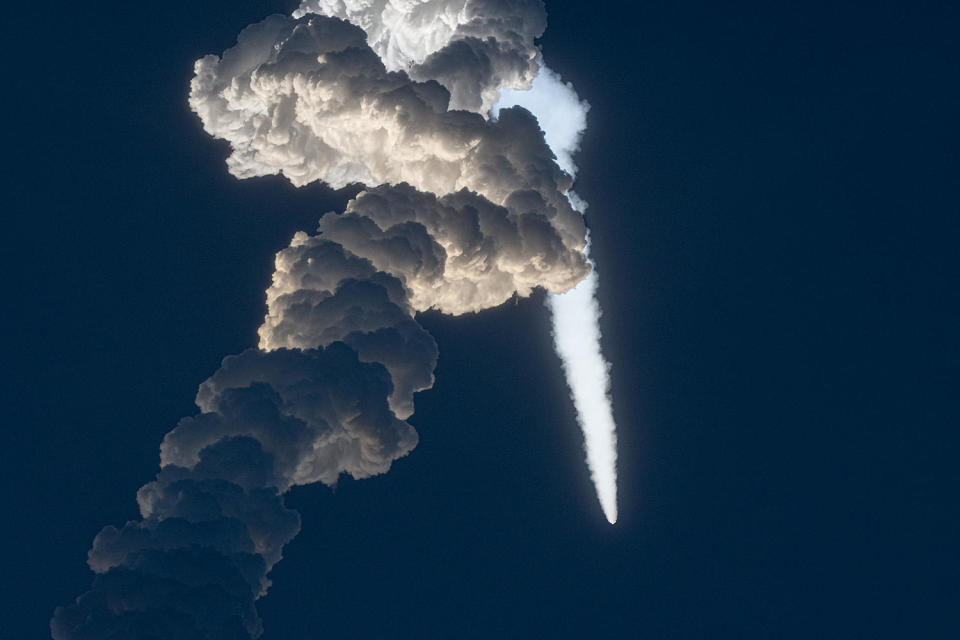 The Atlas 5 put on a spectacular early morning show as it climbed out of the lower atmosphere atop a long, billowing trail of exhaust from its five strap-on solid-fuel boosters. / Credit: William Harwood/CBS News