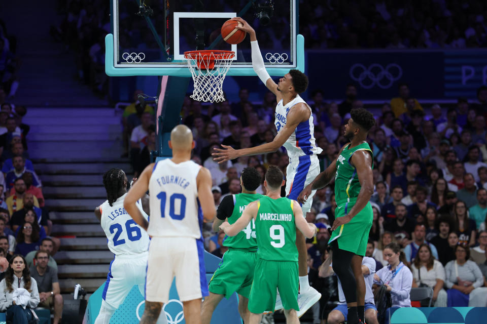 France's #32 Victor Wembanyama goes to the basket in the men's preliminary round group B basketball match between France and Brazil during the Paris 2024 Olympic Games at the Pierre-Mauroy stadium in Villeneuve-d'Ascq, northern France, on July 27, 2024. (Photo by Thomas COEX / AFP) (Photo by THOMAS COEX/AFP via Getty Images)