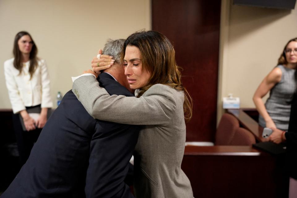 Alec Baldwin and his wife, Hilaria Baldwin, embrace in the courtroom