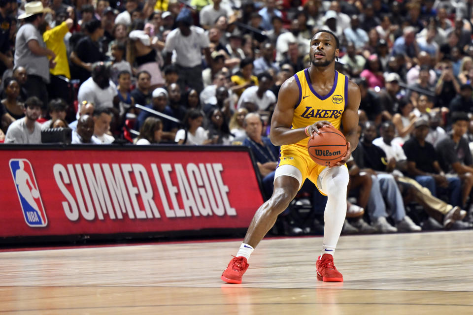 Los Angeles Laker guard Bronny James Jr. looks to attempt a 3-pointer during the first half of an NBA summer league basketball game against the Houston Rockets Friday, July 12, 2024, in Las Vegas. (AP Photo/David Becker)