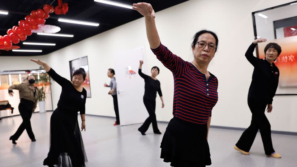 Retired kindergarten teacher Ma Qiuhua, 67, practices dance with other elderly women at Mama Sunset, a learning centre for middle-aged and senior people in Beijing, China, January 15, 2024. - Tingshu Wang/Reuters