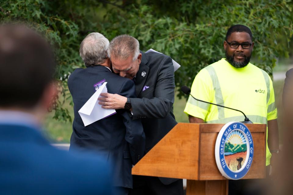 Gov. Mike DeWine hugs Dom Tiberi, who's daughter died in a distracted-driving accident, during a press conference in 2023 announcing that the distracted-driving law would be enforced that day.