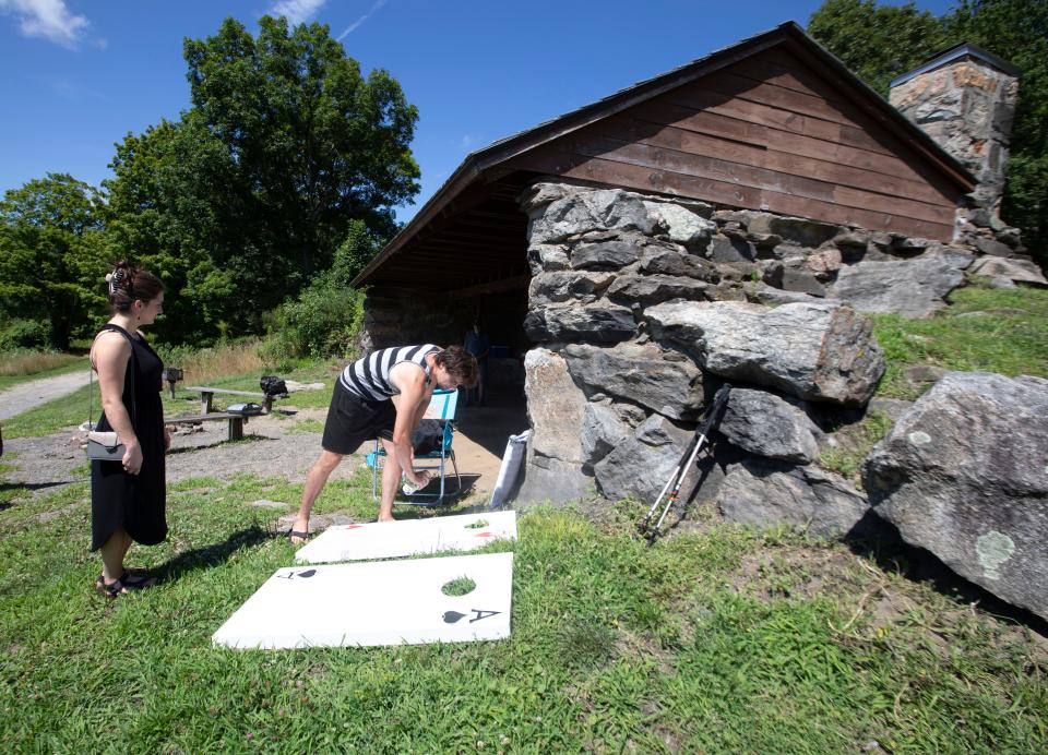 Griffin Kalin of Woodbury, Conn. and Karen Larkin of Cheshire, Conn. prepare for a family picnic at one of the shelters in Ward Pound Ridge Reservation July 11, 2024. Ward Pound Ridge is Westchester County Park that straddles the Town of Lewisboro and the Town of Pound Ridge, and spans 4,700 acres. It includes hiking, cross-country skiing and horseback riding trails.