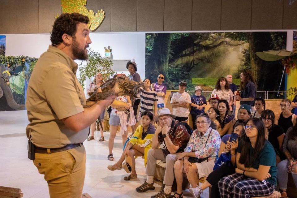 Animal educator JoJo Kerschner showcases Donatello, an alligator snapping turtle, at the Conservation Ambassadors’ “Wild Things” exhibit at the State Fair on Wednesday.