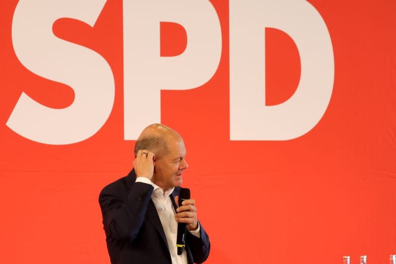 German Chancellor Olaf Scholz speaks at a citizens' dialog in the Weimarhalle, as part of the Social Democratic Party (SPD)'s campaign for the state elections in Thuringia. Bodo Schackow/dpa