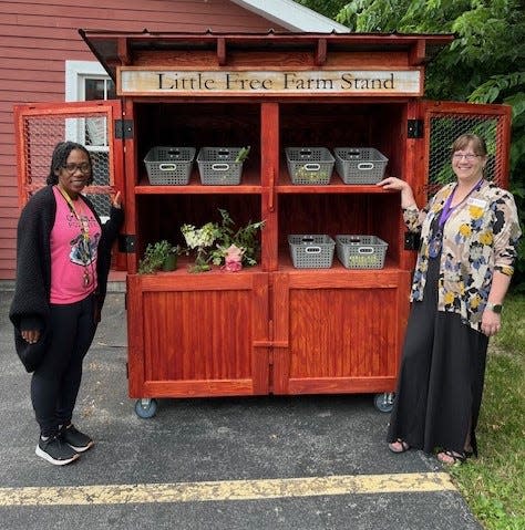 Wood Library Adult Services Librarian Alexis Lawrence and Administrative Assistant Cyndi Fordham staff the Little Free Farm Stand, which is now open at the library, 134 N. Main St., Canandaigua.