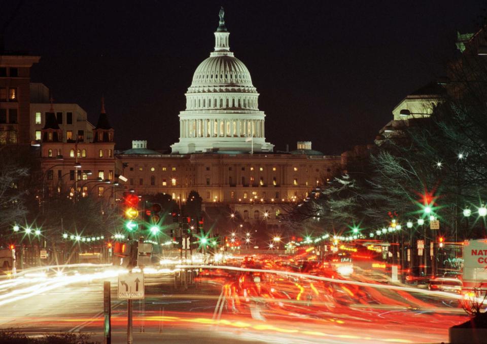 Traffic streams down Pennsylvania Avenue towards the U.S. Capitol grounds after nightfall December 15 as the House of Representatives prepares to convene December 17 to debate the impeachment of President Bill Clinton. A House vote for impeachment would send the case to the Senate for a trial.

TB/RC/CLH/