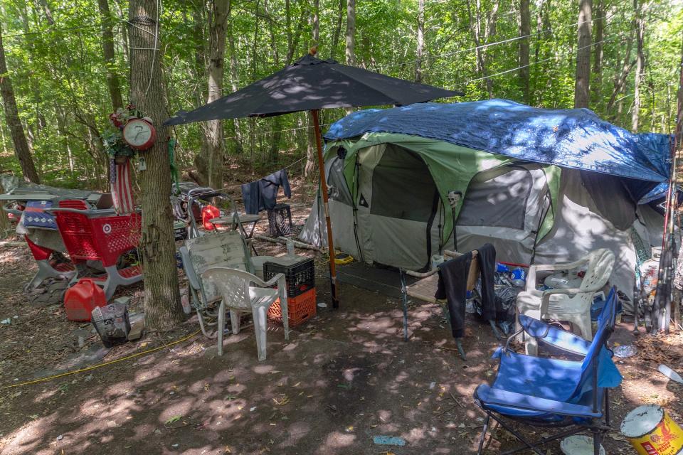 The homeless encampment behind the Neptune ShopRite and Zenleaf off Route 66 has existed for more than a decade, but could come to an end this summer. With 2,000 trash bags piled up, the property owner and township are working to find permanent housing for those who still call the camp home.