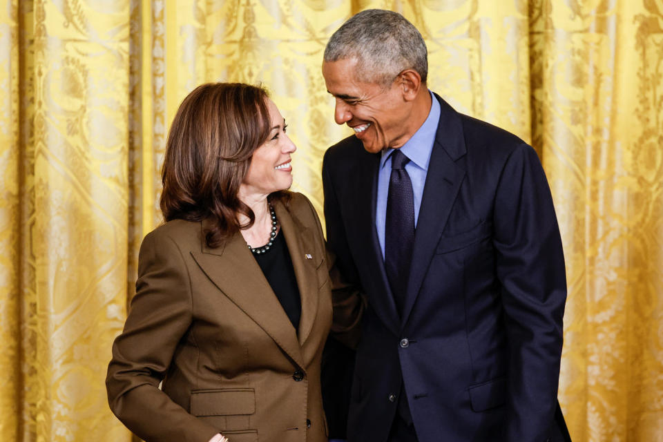 From left, Kamala Harris and Barack Obama smile at each other while standing side by side (Chip Somodevilla / Getty Images file)