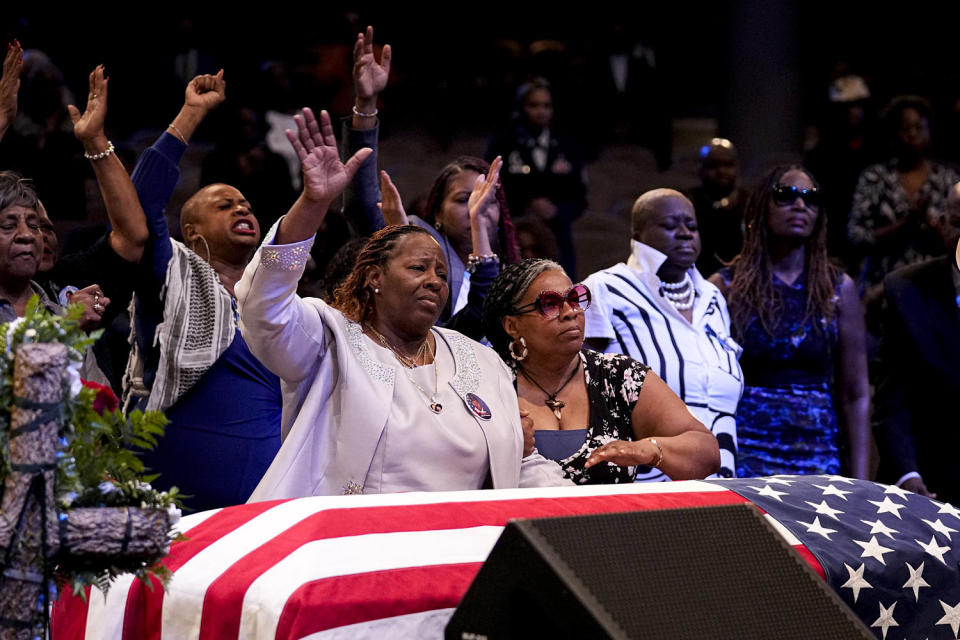 Chantemekki Fortson, front left, stands with friends and family during the funeral for Fortson. (Brynn Anderson / AP)