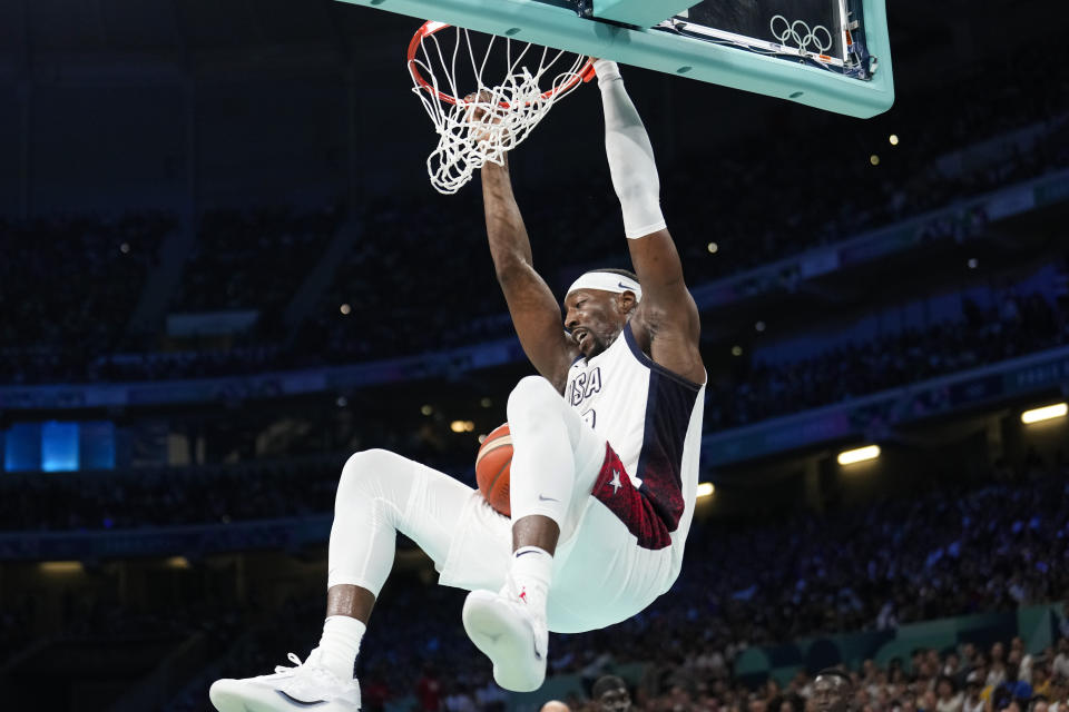 Bam Adebayo, of the United States, gets a basket on a dunk against South Sudan in a men's basketball game at the 2024 Summer Olympics, Wednesday, July 31, 2024, in Villeneuve-d'Ascq, France. (AP Photo/Mark J. Terrill)