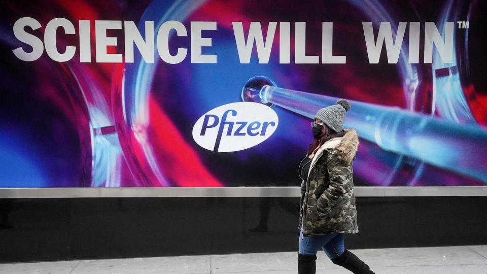 PHOTO: In this file photo, a person walks past the Pfizer Headquarters building in the Manhattan borough of New York City, Dec. 7, 2020. (Carlo Allegri/Reuters)