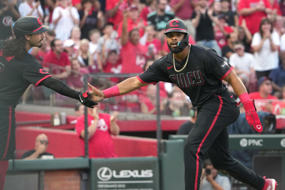 CINCINNATI, OHIO - JULY 12: Rece Hinds #77 of the Cincinnati Reds celebrates a run with Jonathan India #6 of the Cincinnati Reds during the second inning against the Miami Marlins at Great American Ball Park on July 12, 2024 in Cincinnati, Ohio. (Photo by Jason Mowry/Getty Images)