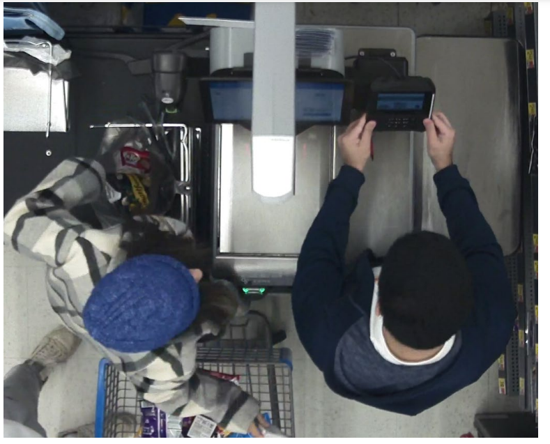 Authorities say this security image from the Walmart on Post Road in Warwick shows the people alleged to have planted skimming devices at self-checkout terminals.