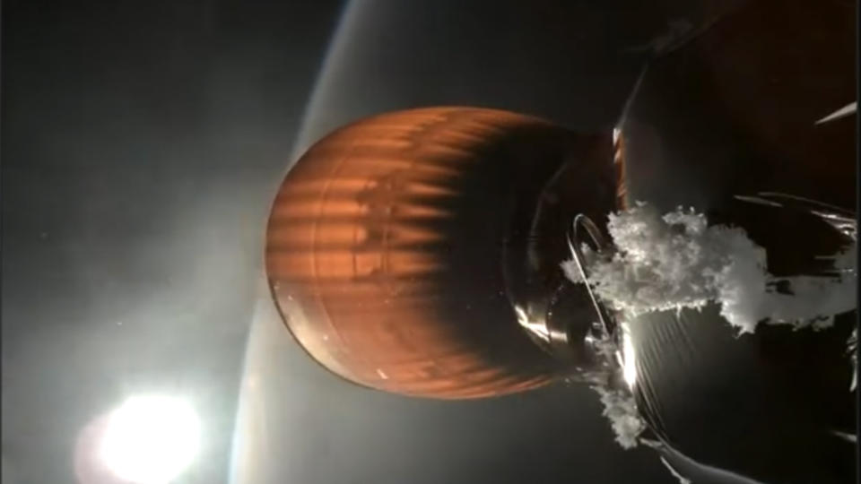 Screenshot from the webcast of a SpaceX Starlink launch on July 11, 2024, showing a buildup of white material on the upper stage of a Falcon 9 rocket.