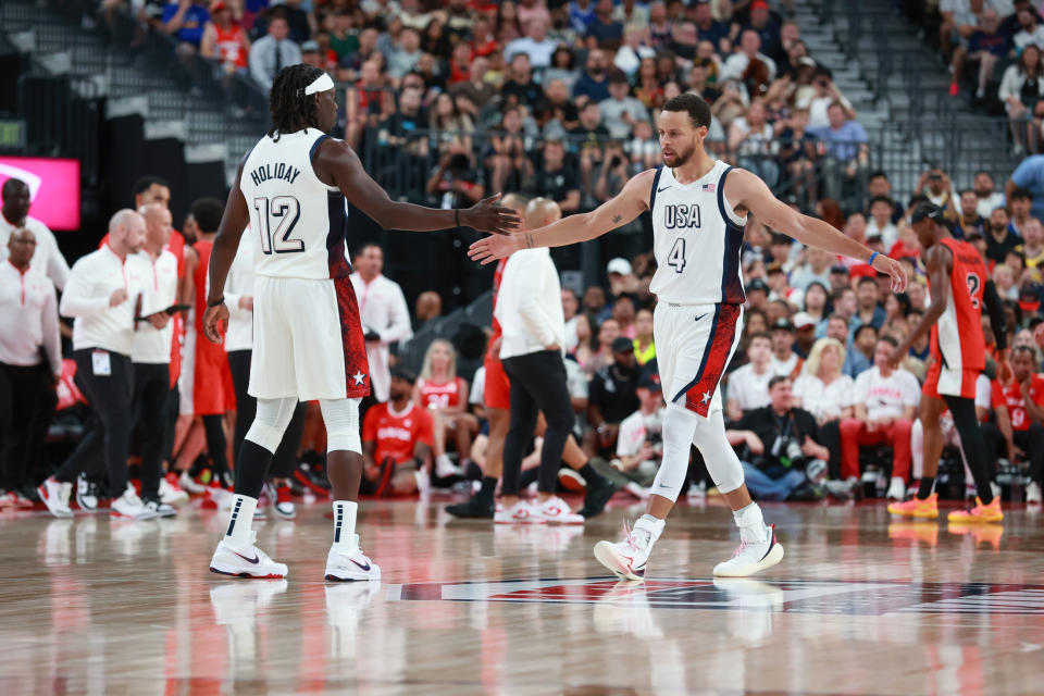 LAS VEGAS, NV - JULY 10:  Jrue Holiday #12 of Team USA and Stephen Curry #4 of Team USA looks on during the game against Team Canada on July 10, 2024 at the T-Mobile Arena in Las Vegas, Nevada. NOTE TO USER: User expressly acknowledges and agrees that, by downloading and/or using this Photograph, user is consenting to the terms and conditions of the Getty Images License Agreement. Mandatory Copyright Notice: Copyright 2024 NBAE (Photo by Nathaniel S. Butler/NBAE via Getty Images)