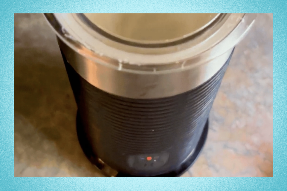 Gif of the Keurig K-Café Barista Bar's milk frother working