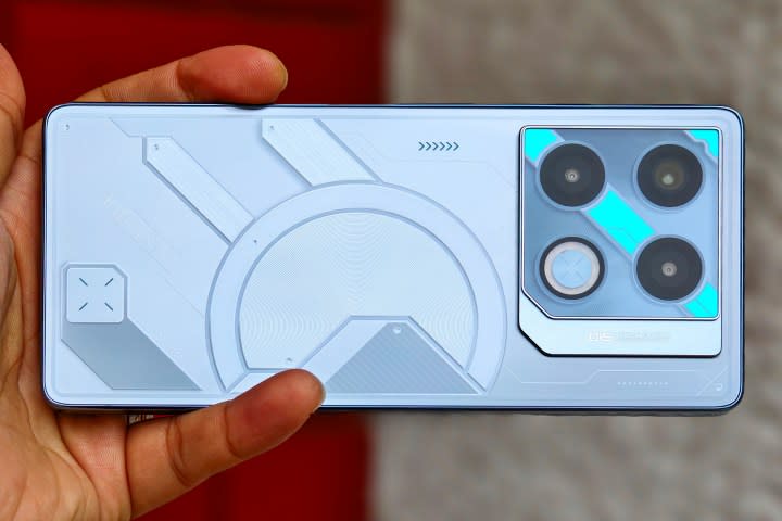 Infinix GT 20 Pro gaming phone held in hand.