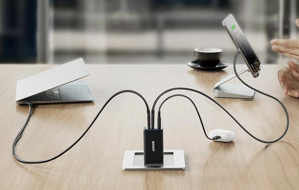 Anker USB C Nano II Charger being used to charge three devices at once