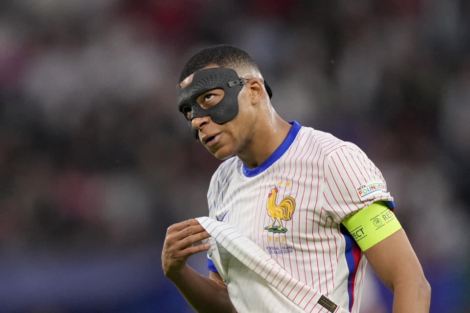 Kylian Mbappe of France reacts after missing an opportunity during a quarter final match between Portugal and France at the Euro 2024 soccer tournament in Hamburg, Germany, Friday, July 5, 2024. (AP Photo/Andreea Alexandru)