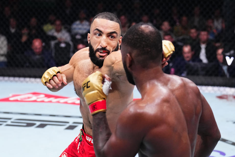 MANCHESTER, ENGLAND - JULY 27: (L-R) Belal Muhammad punches Leon Edwards of Jamaica in the UFC welterweight championship bout during the UFC 304 event at Co-op Live on July 27, 2024 in Manchester, England.  (Photo by Chris Unger/Zuffa LLC via Getty Images)