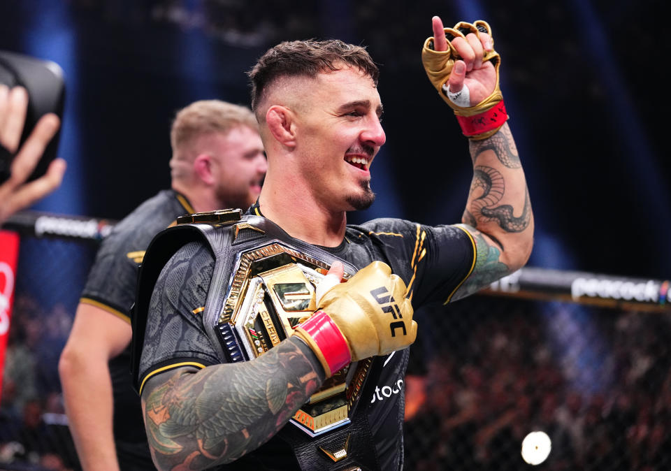 MANCHESTER, ENGLAND - JULY 27: Tom Aspinall of England reacts after his knockout victory against Curtis Blaydes in the interim UFC heavyweight championship bout during the UFC 304 event at Co-op Live on July 27, 2024 in Manchester, England.  (Photo by Chris Unger/Zuffa LLC via Getty Images)