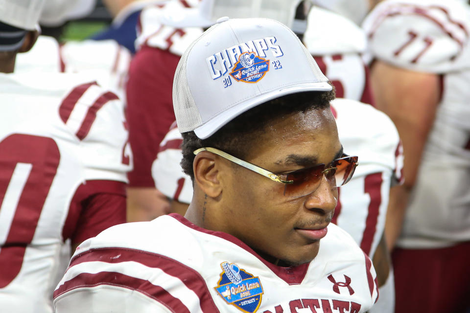 DETROIT, MI - DECEMBER 26:  New Mexico State Aggies defensive back Andre Seldon (8) is seen wearing the Quick Lane Bowl Champs baseball cap during the awards ceremony following the Quick Lane Bowl college football game between the New Mexico State Aggies and the Bowling Green Falcons on December 26, 2022 at Ford Field in Detroit, Michigan.  (Photo by Scott W. Grau/Icon Sportswire via Getty Images)