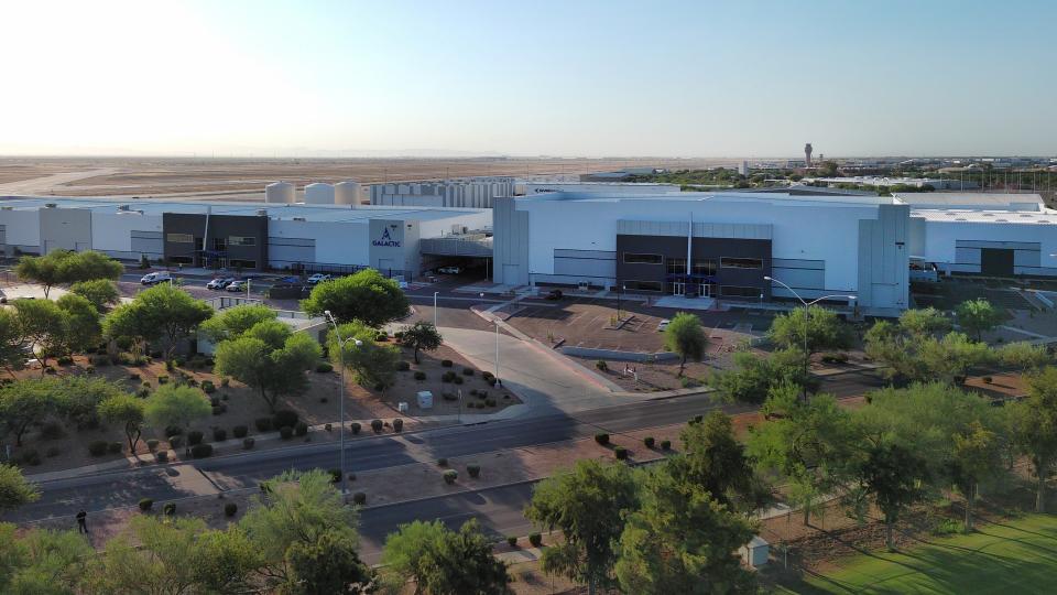  A large complex consisting of several large white buildings, seen from high in the air. 