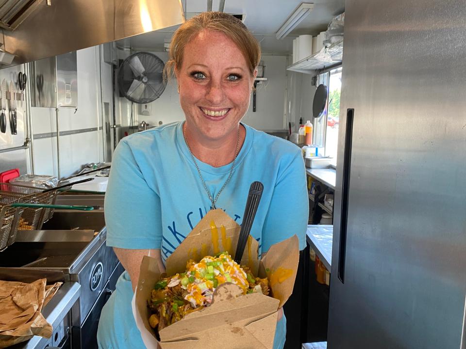 Kristen Macedo, Co-Owner of Poutine Peddlers, located at 239 Broadway in Taunton, serving up award-winning fries. June 25, 2024.