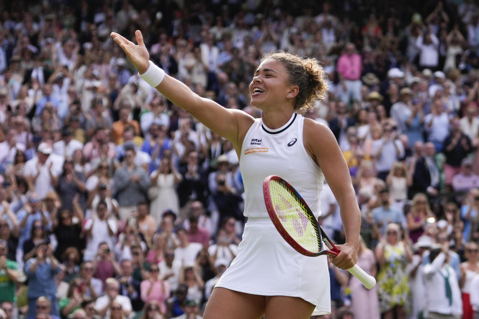 Jasmine Paolini of Italy celebrates after defeating Donna Vekic of Croatia in their semifinal match at the Wimbledon tennis championships in London, Thursday, July 11, 2024. (AP Photo/Alberto Pezzali)